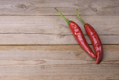 High angle view of red chili peppers on table