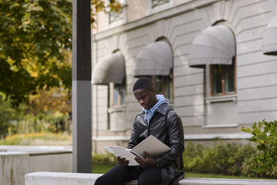Young man reading documents