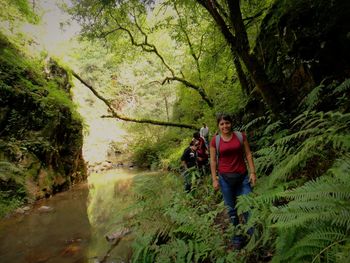 Woman walking in forest