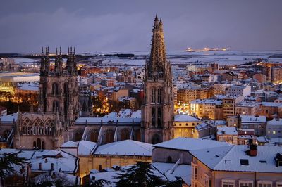 High angle view of illuminated buildings against sky during winter