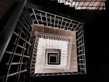 Directly below shot of spiral staircase of building