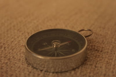 Close-up of clock on table