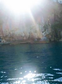 Scenic view of sea against sky on sunny day