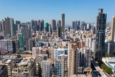 Modern buildings in city against clear sky