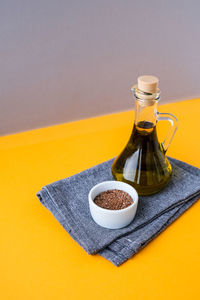 Flax seeds with oil in glass bottle. healthy food concept. vegan keto 