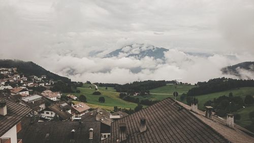 Cityscape against cloudy sky