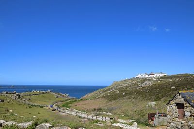 Scenic view of sea against clear blue sky