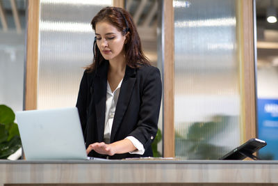 Young woman using mobile phone