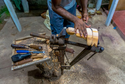 High angle view of man working on wood