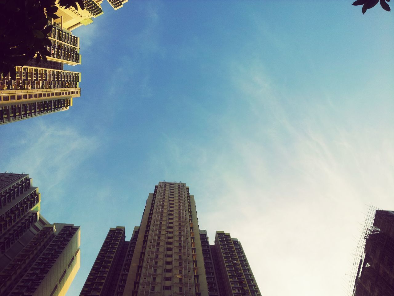 building exterior, architecture, built structure, low angle view, skyscraper, city, tall - high, modern, office building, sky, tower, building, cloud - sky, tall, city life, outdoors, day, no people, financial district, cloud