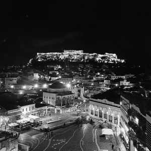 High angle view of illuminated buildings in city at night