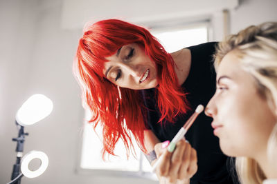 Portrait of young woman making face