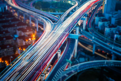 High angle view of light trails on road at night