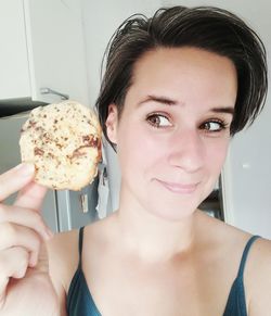 Portrait of woman holding ice cream