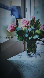 Close-up of pink roses in vase