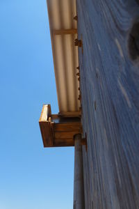 Low angle view of wooden structure against clear sky