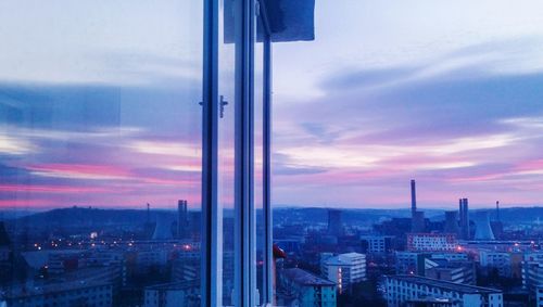 Cityscape against sky during sunset