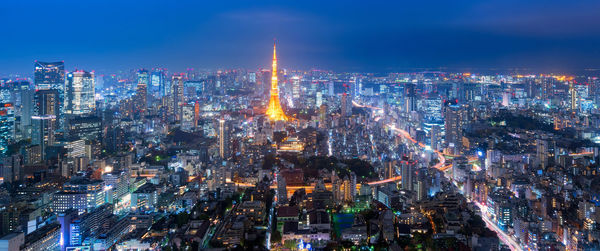 Aerial view of illuminated city at night