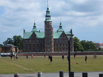 People in front of historical building