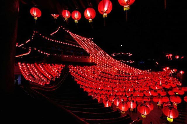 red, hanging, decoration, illuminated, in a row, lighting equipment, night, cultures, lantern, tradition, indoors, low angle view, culture, large group of objects, abundance, celebration, chinese lantern, repetition, religion, multi colored