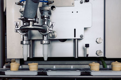 Manufacturin for automatic production of ice cream cones. conveyor belt in waffle cups, creme brulr