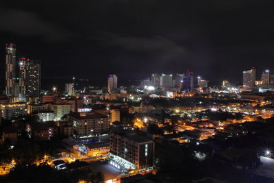 High angle view of illuminated buildings in city at night