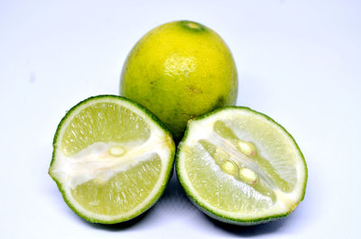 Close-up of lemon slice against white background