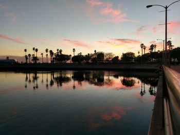 Scenic view of lake against orange sky