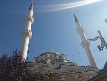 Low angle view of cross against clear sky