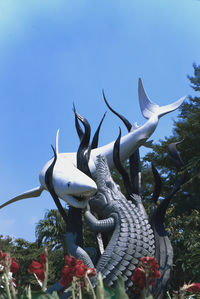 Low angle view of statue against clear sky