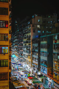 High angle view of illuminated buildings in city