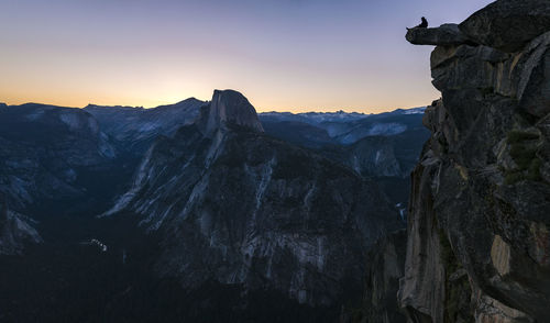 Scenic view of rocky mountains during sunset