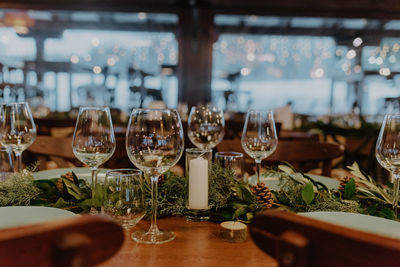 Close-up of wineglasses on table