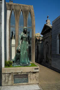 Statue of historic building against sky