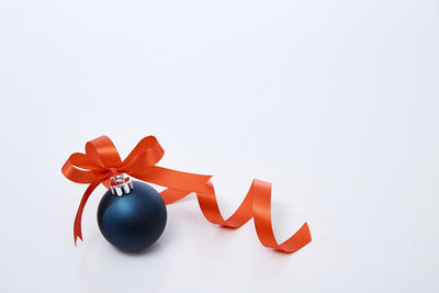 Close-up of red umbrella against white background