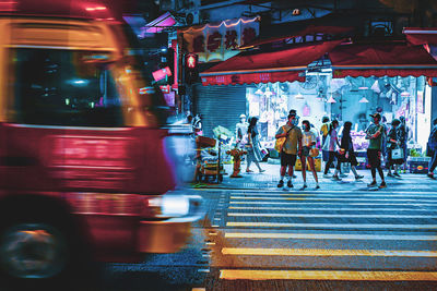 People crossing road at night