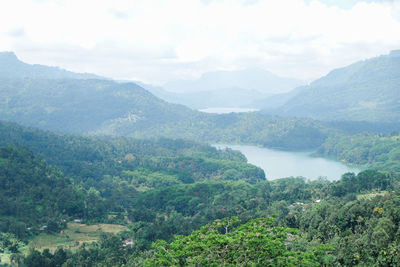 Scenic view of landscape and mountains against sky