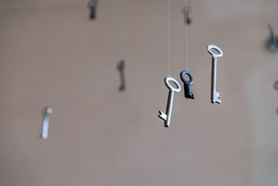 Close-up of empty hanging from metal