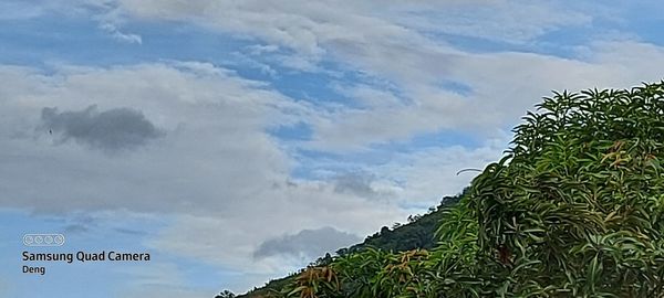 Low angle view of sign against sky