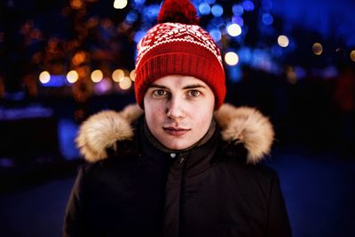 Portrait of man in warm clothing outdoors at night