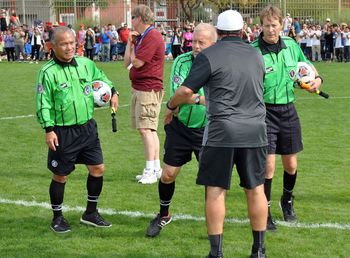 Men standing on soccer field