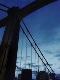 Low angle view of crane against sky