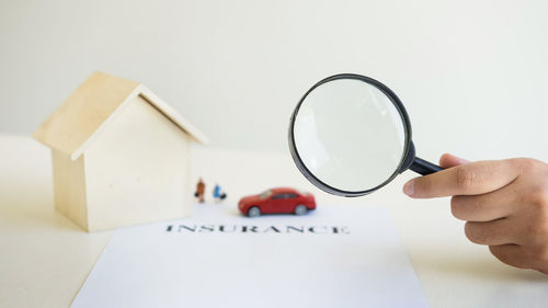 Close-up of hand holding paper