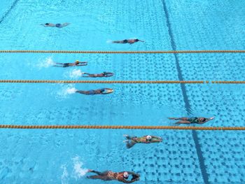 High angle view of people swimming in pool