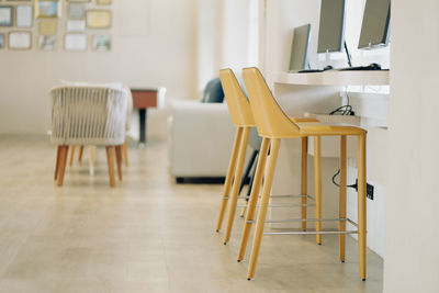 Empty chairs and tables in cafe