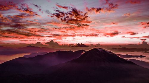 Scenic view of mountains against sky at sunset