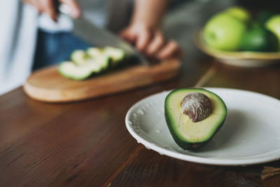 Close-up of fruits in plate on table