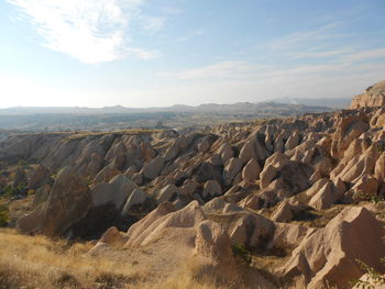 Panoramic view of rock formations against sky