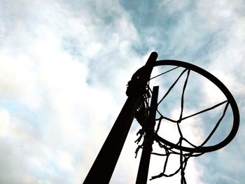 Low angle view of silhouette metal against sky