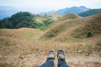 Low section of person standing on land